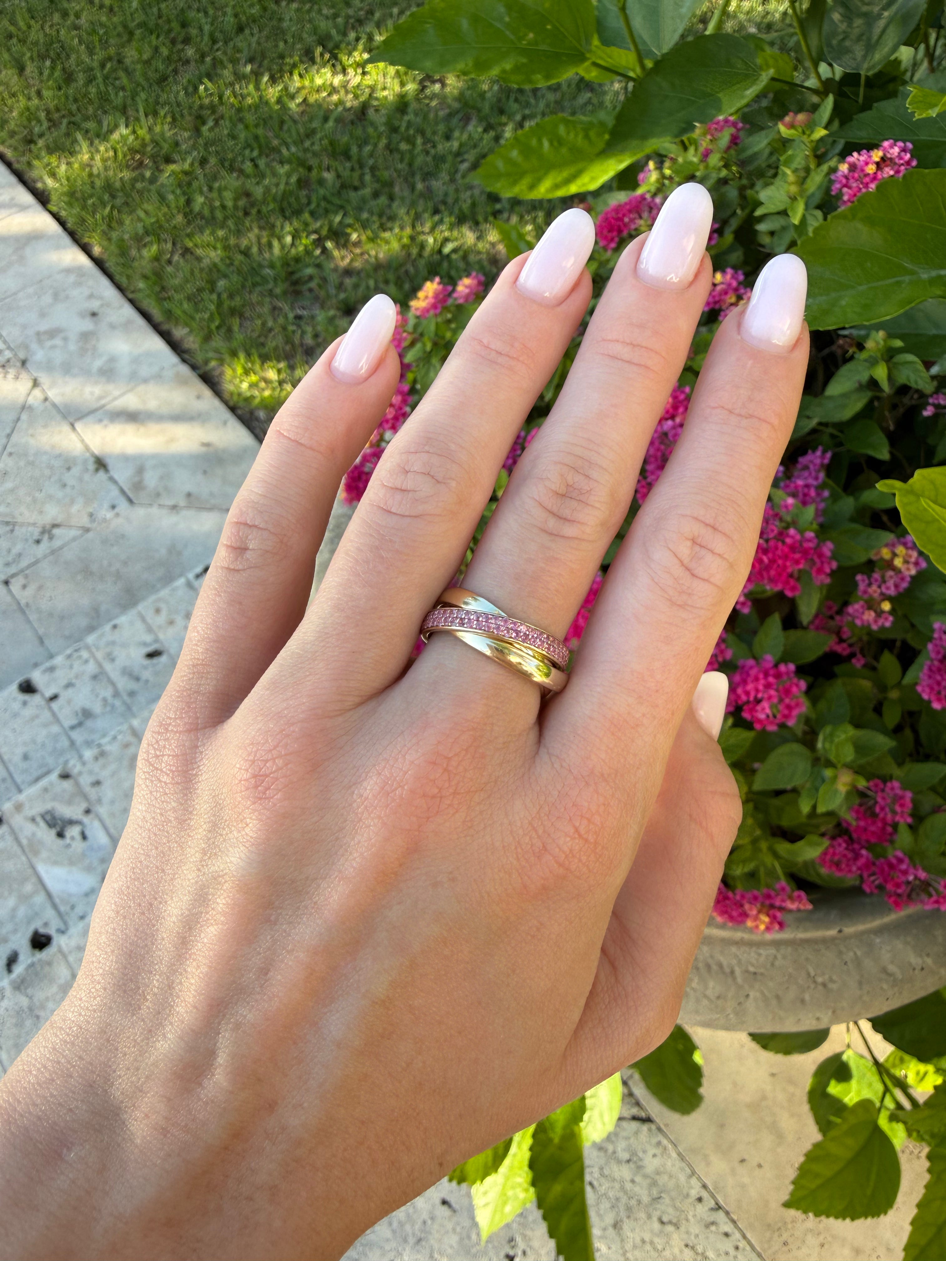 Threefold interlocking natural pink sapphire ring in solid 14k gold